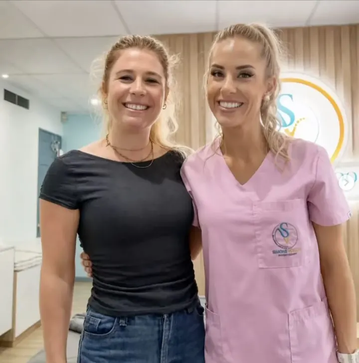 Simone with a patient at her practice